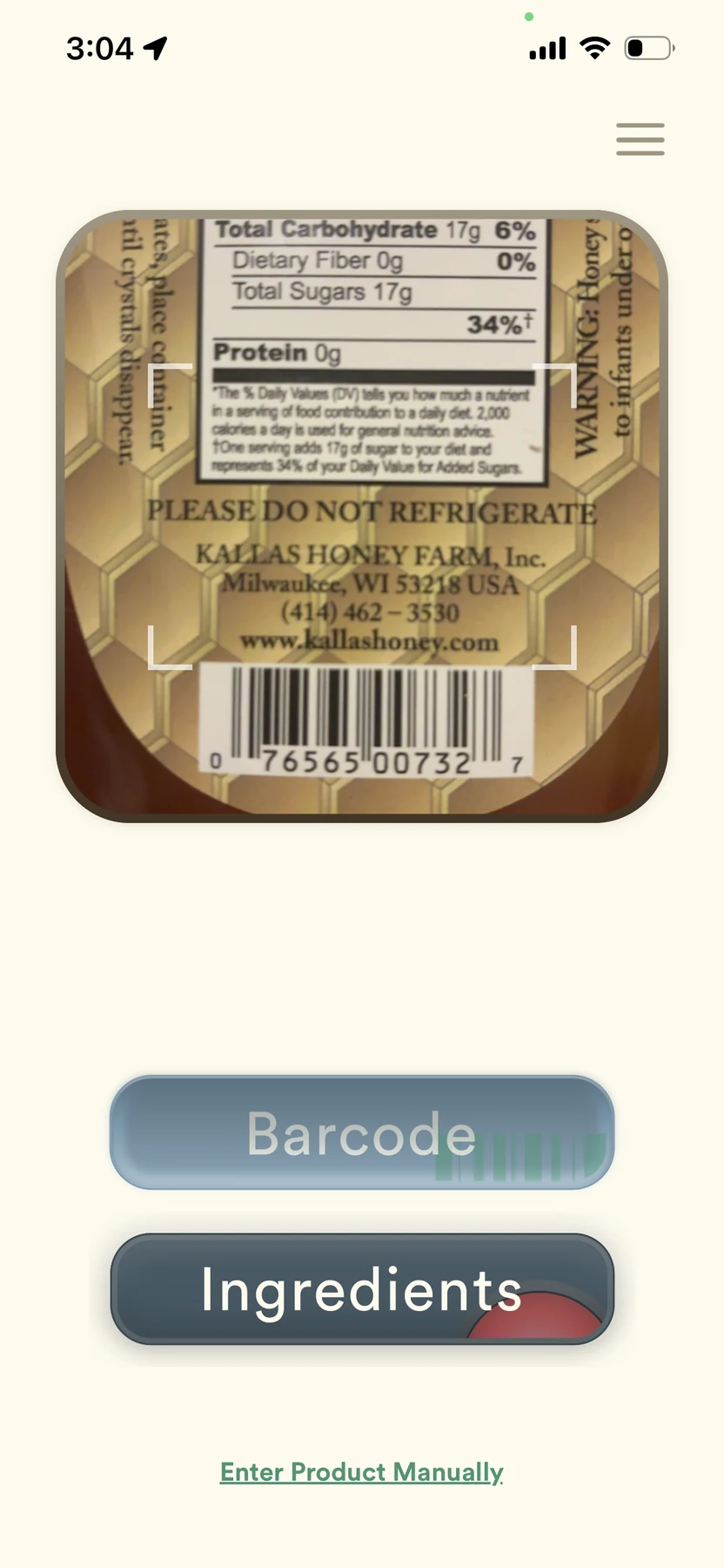 Ingredient Inspector scan screen: the camera framing the barcode and nutrition label on a jar of Kallas honey, with Barcode and Ingredients mode buttons below.